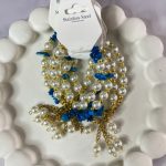 دستبند مرواریدی گوی و سنگ توپاز آبی آویز دار